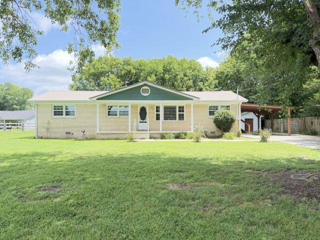 1300 Pleasant Ridge Road Huntland, TN 37345 - Photo 1 of 22 a view of a house with backyard porch and garden