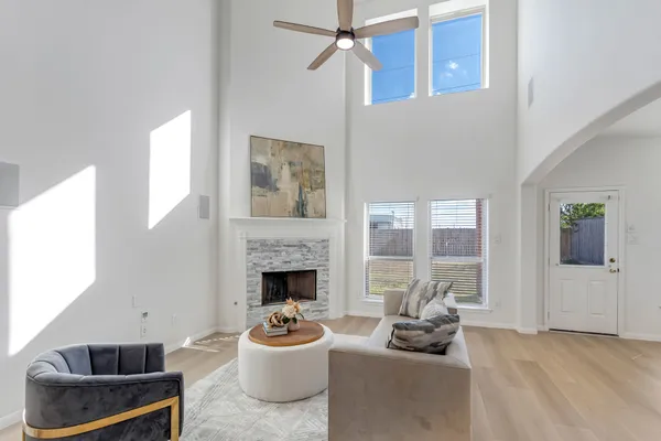 a living room with furniture and a fireplace