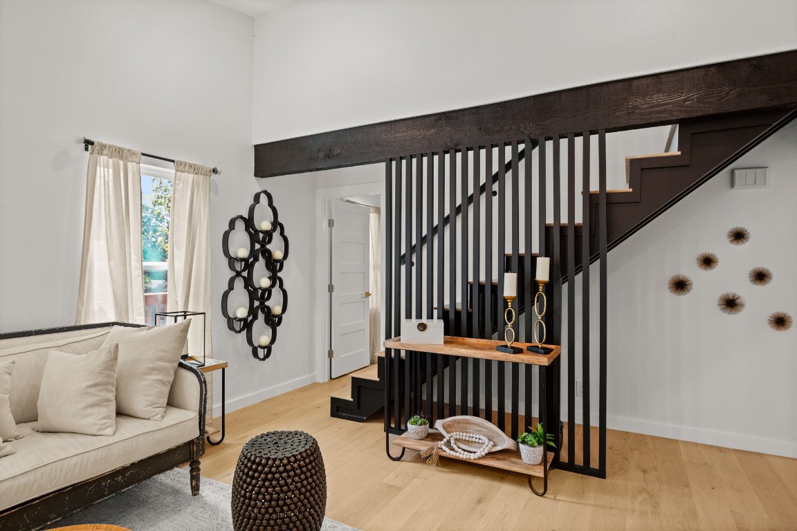 3904 Highland Drive Austin, TX 78734 - Photo 13 of 37 Living area with light wood-type flooring, stairway, and a high ceiling