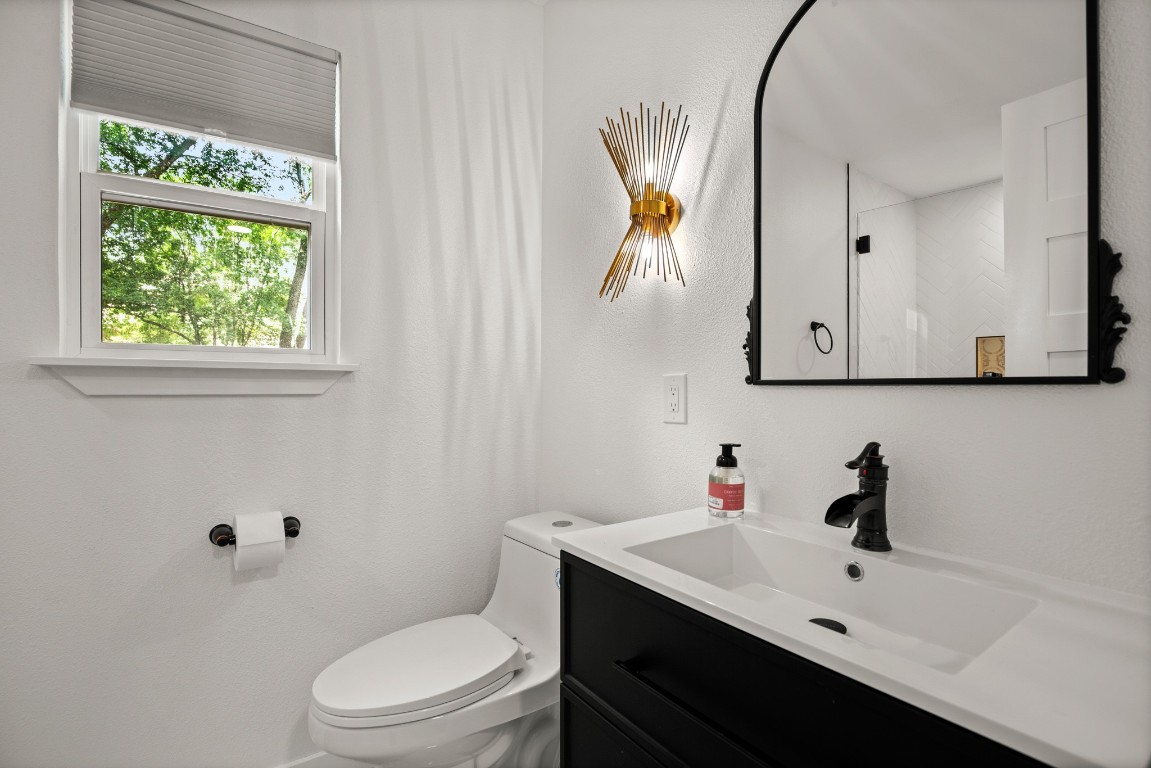 3904 Highland Drive Austin, TX 78734 - Photo 26 of 37 Bathroom with vanity and a shower
