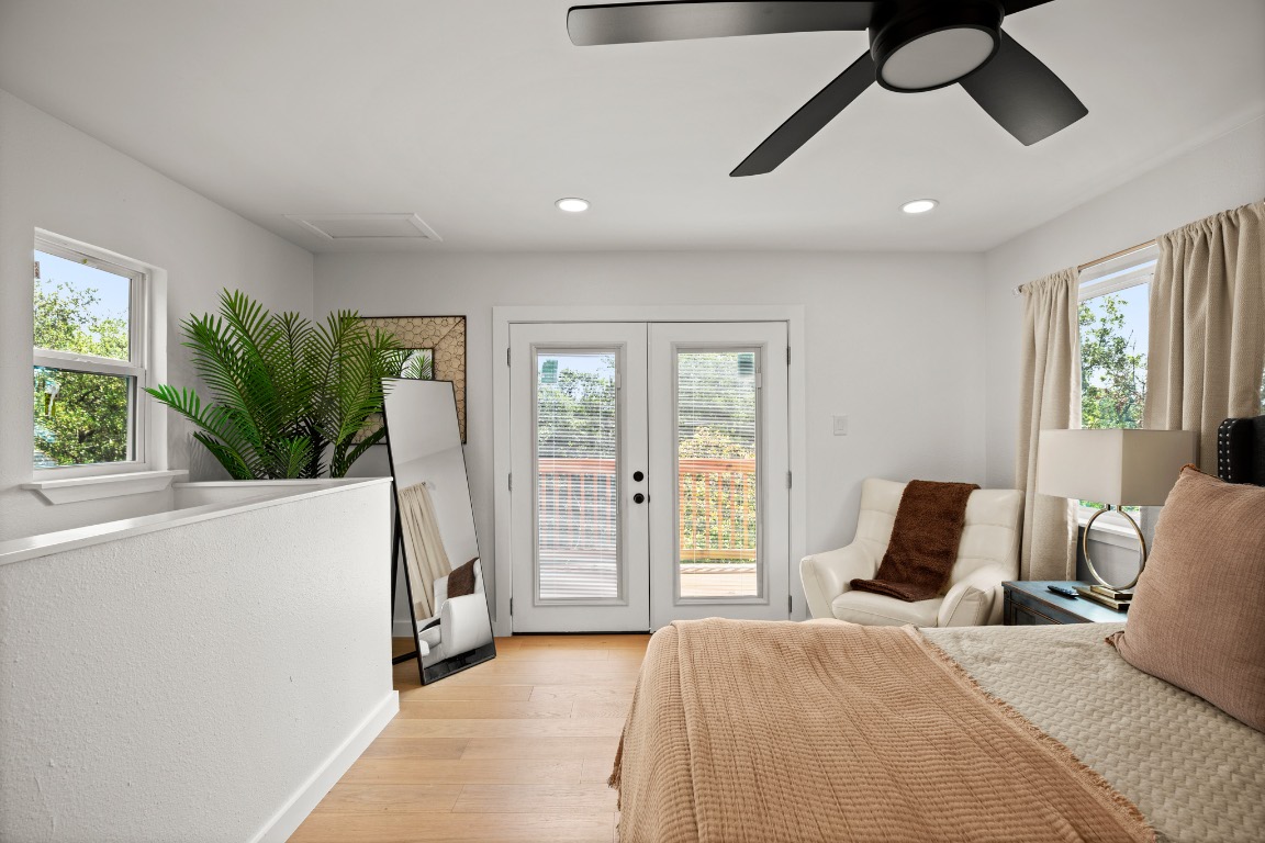 3904 Highland Drive Austin, TX 78734 - Photo 33 of 37 Bedroom with multiple windows, light wood-type flooring, ceiling fan, access to exterior, and recessed lighting