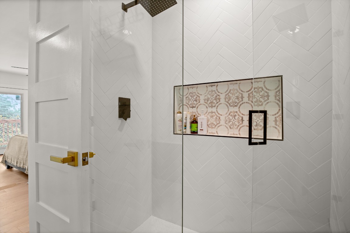 3904 Highland Drive Austin, TX 78734 - Photo 37 of 37 Ensuite bathroom featuring a tile shower