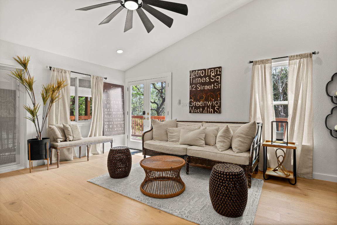 3904 Highland Drive Austin, TX 78734 - Photo 7 of 37 Living area featuring lofted ceiling, light wood finished floors, plenty of natural light, ceiling fan, and recessed lighting