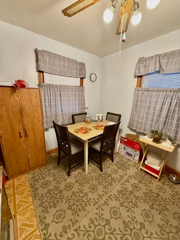 a outdoor space with a table and chairs