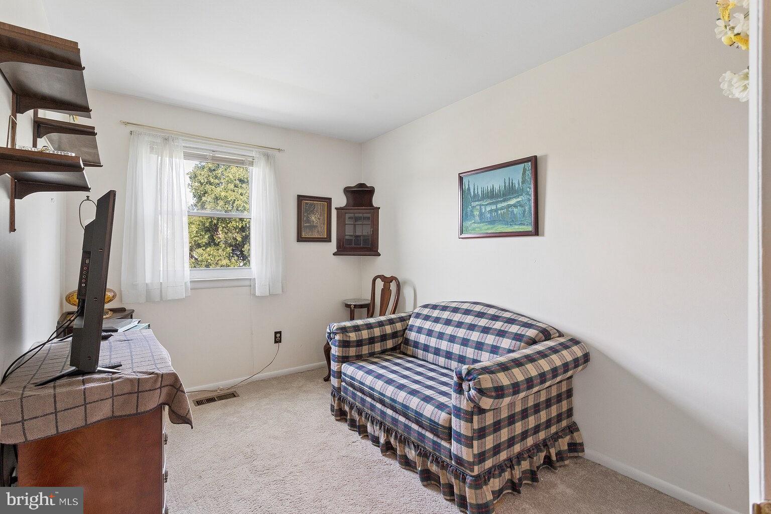 12010 Academy Road Philadelphia, PA 19154 - Photo 13 of 30 a bedroom with a bed and a window