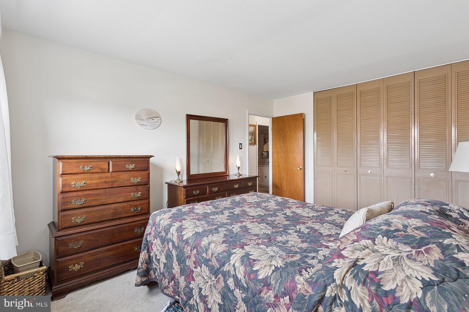 12010 Academy Road Philadelphia, PA 19154 - Photo 16 of 30 a bedroom with a bed and a dresser
