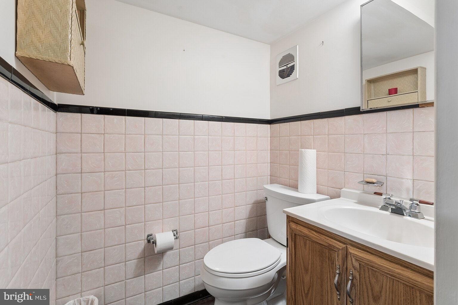 12010 Academy Road Philadelphia, PA 19154 - Photo 22 of 30 a bathroom with a sink a toilet and a mirror
