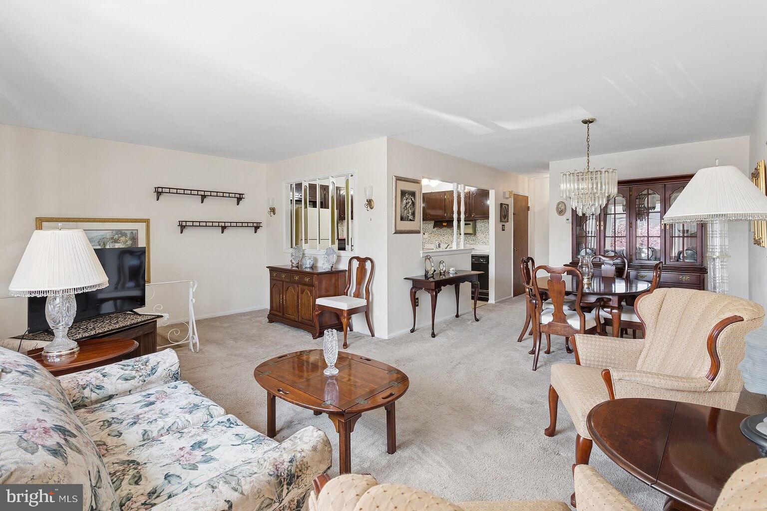 12010 Academy Road Philadelphia, PA 19154 - Photo 5 of 30 a living room with furniture and a chandelier