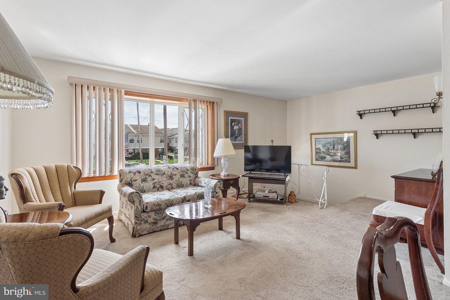 12010 Academy Road Philadelphia, PA 19154 - Photo 7 of 30 a living room with furniture and a flat screen tv