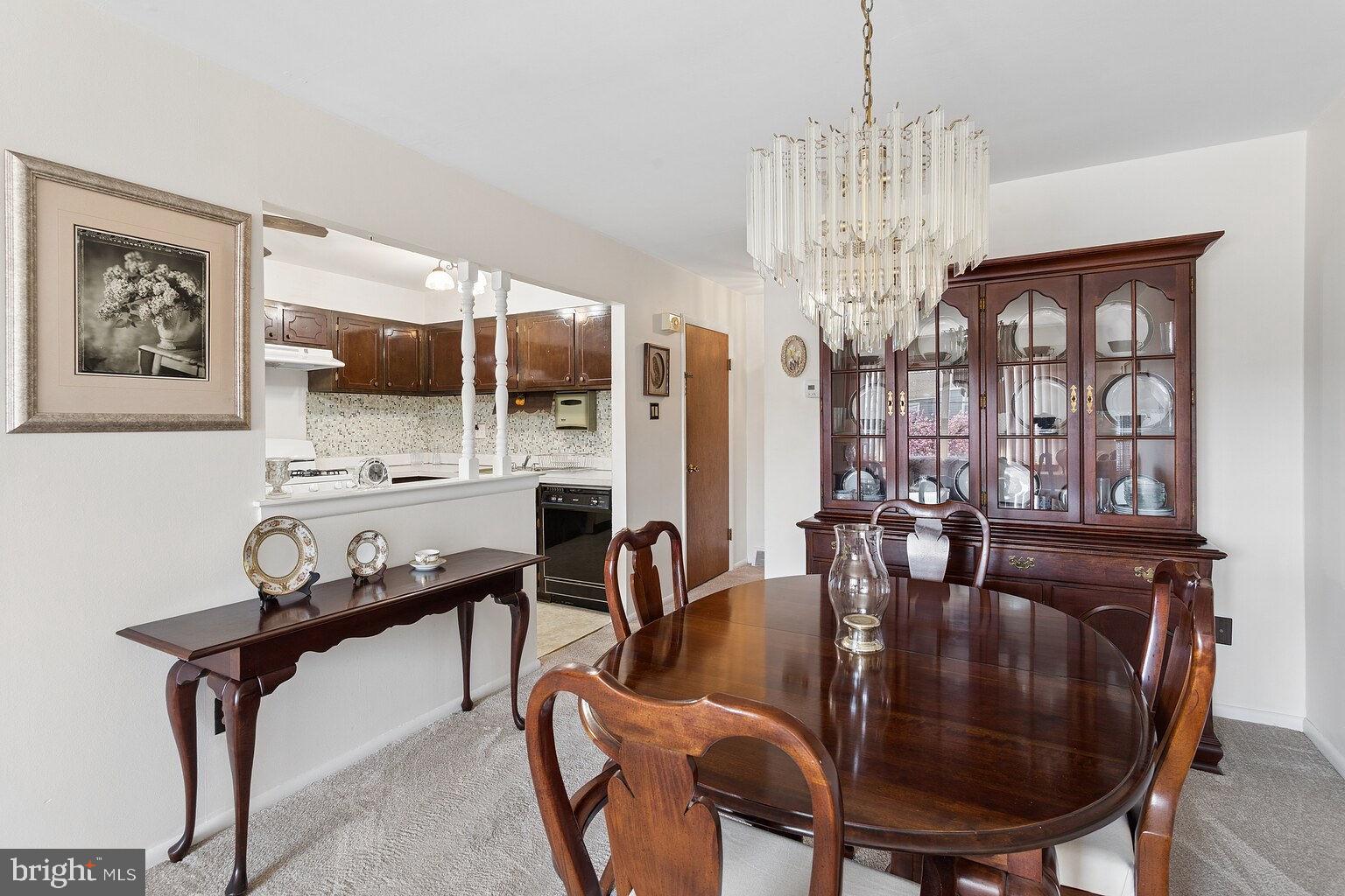12010 Academy Road Philadelphia, PA 19154 - Photo 9 of 30 a dining room with furniture a chandelier and window