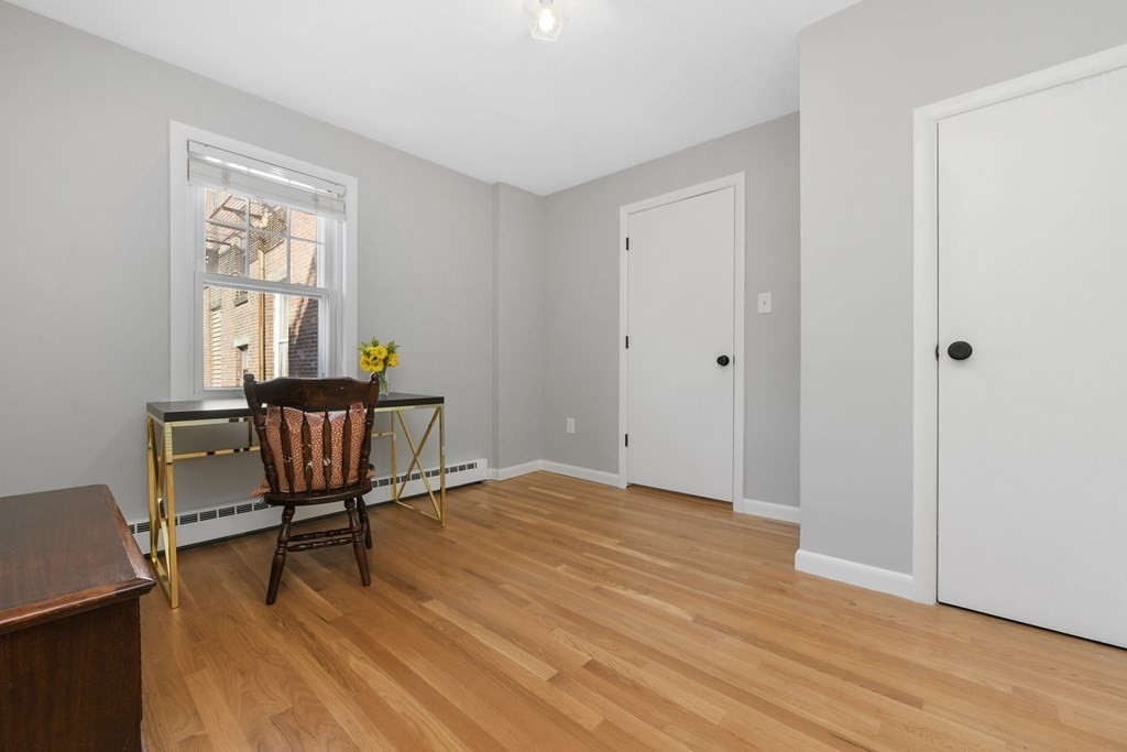 67 Broadway, Unit 1 Chelsea, MA 02150 - Photo 11 of 20 a view of a livingroom with furniture and a window