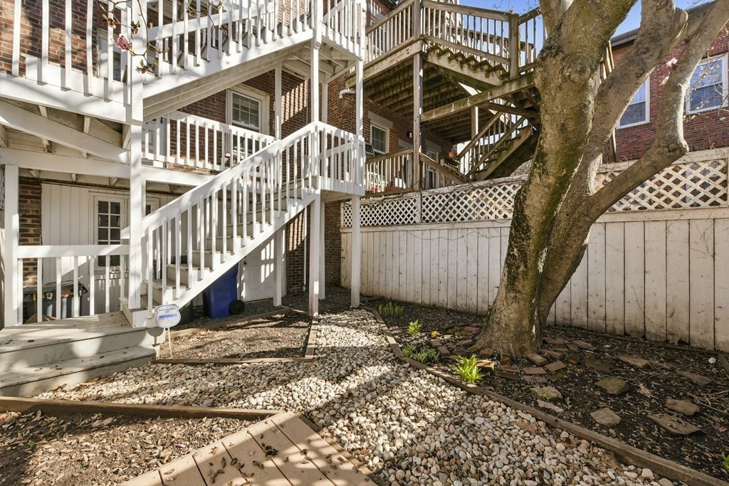 67 Broadway, Unit 1 Chelsea, MA 02150 - Photo 16 of 20 front view of a house with a yard