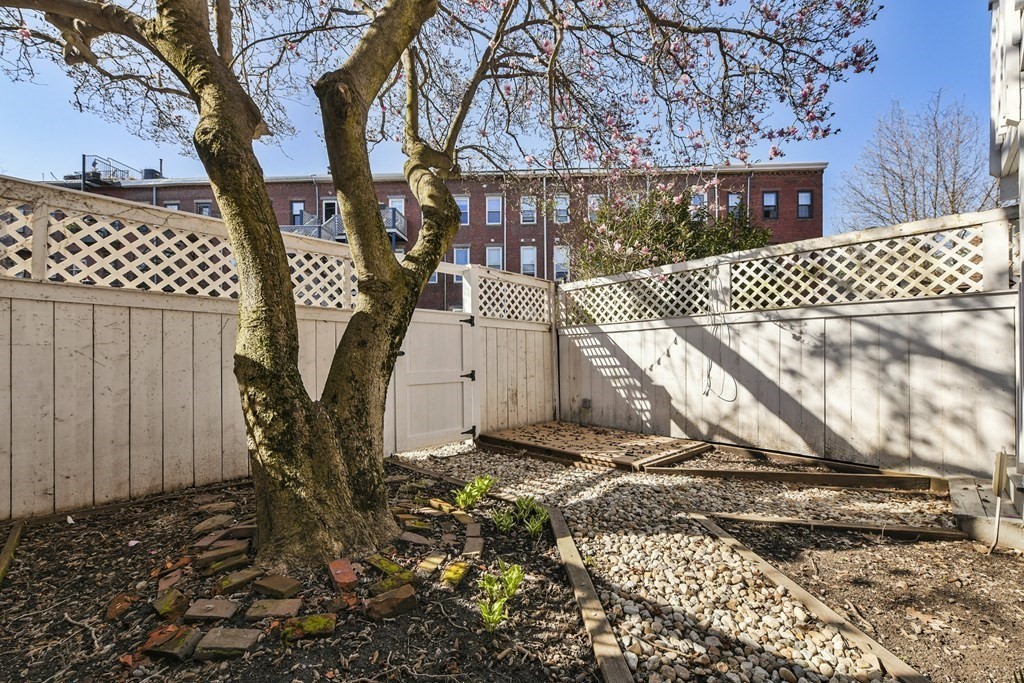 67 Broadway, Unit 1 Chelsea, MA 02150 - Photo 17 of 20 a view of a backyard