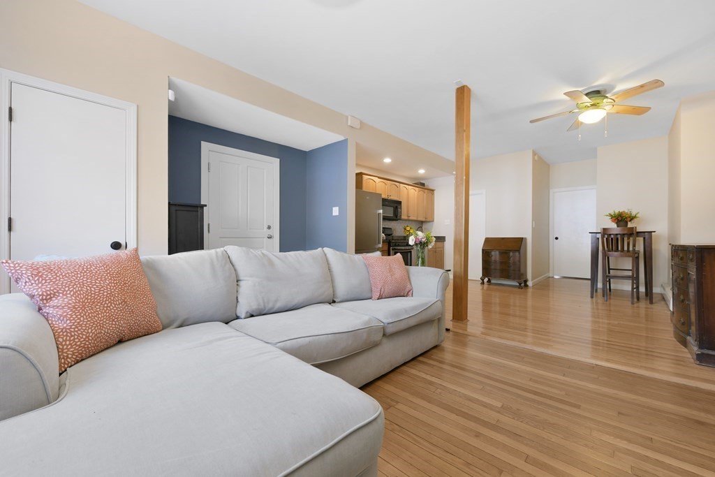 67 Broadway, Unit 1 Chelsea, MA 02150 - Photo 4 of 20 a living room with furniture and wooden floor