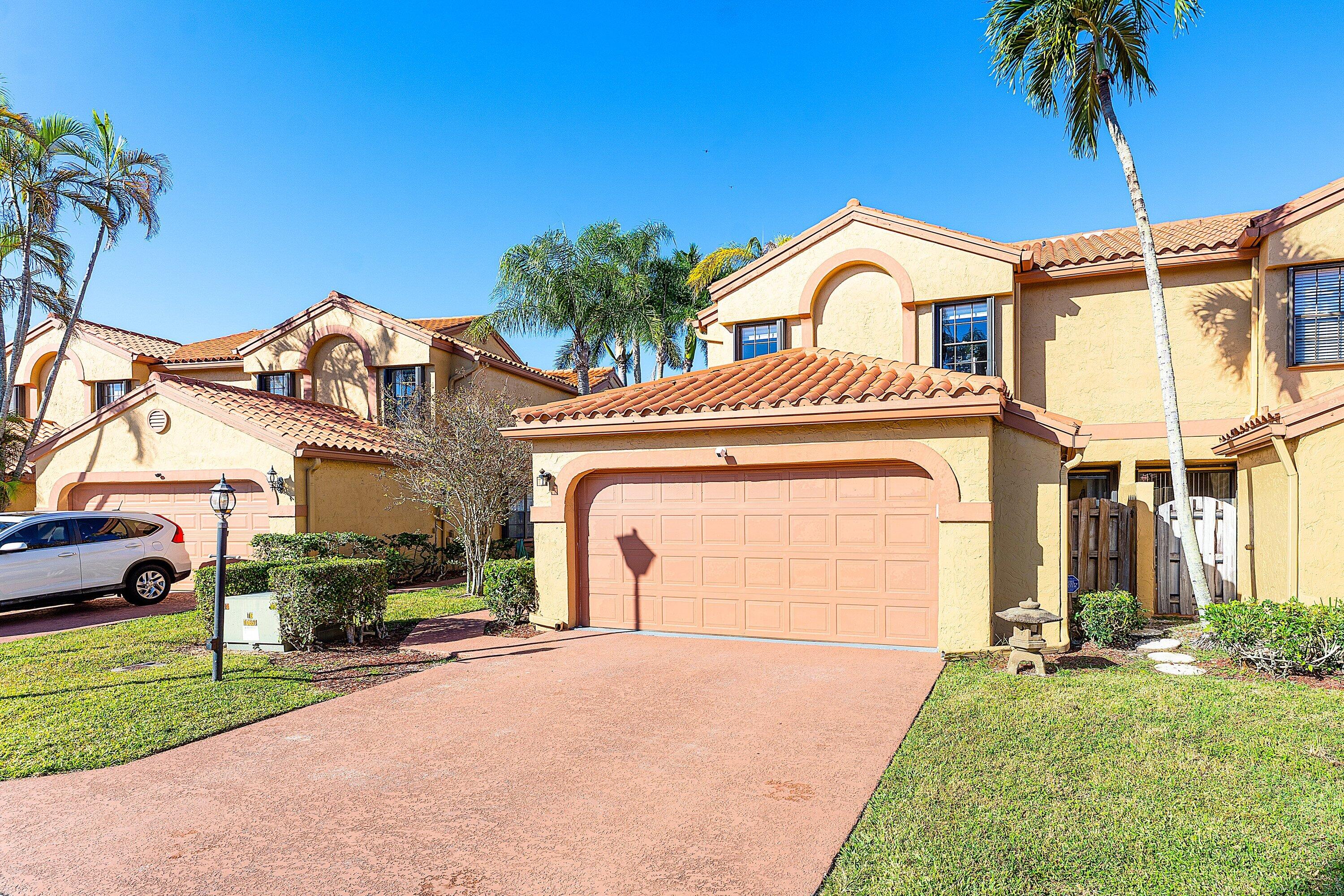 19931 Villa Lante Place Boca Raton, FL 33434 - Photo 2 of 47 a view of a house with a yard and plants
