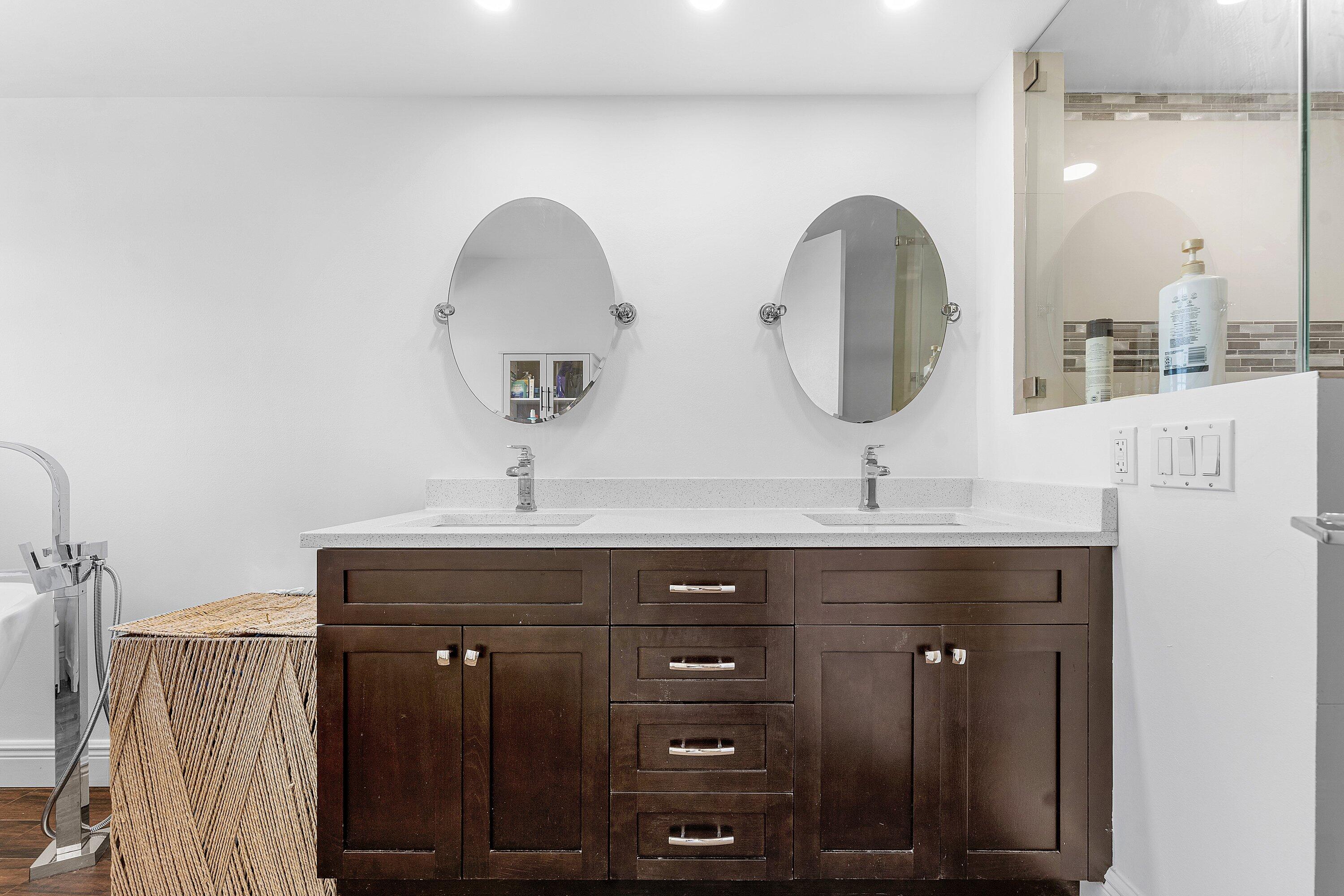 19931 Villa Lante Place Boca Raton, FL 33434 - Photo 26 of 47 a bathroom with a double vanity sink and a mirror