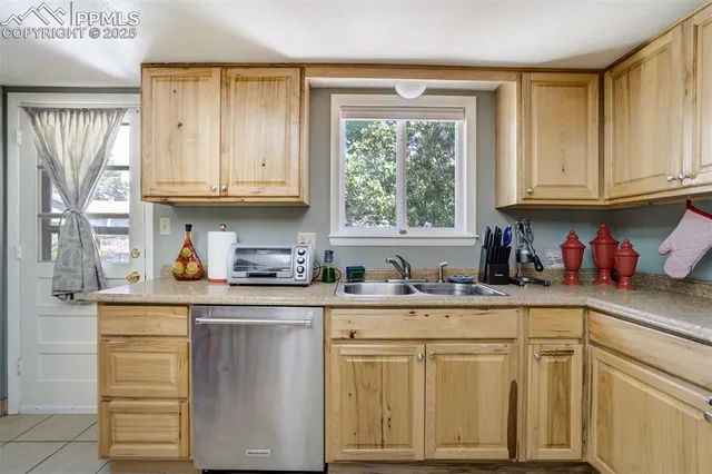 a kitchen with stainless steel appliances granite countertop a refrigerator stove microwave and sink