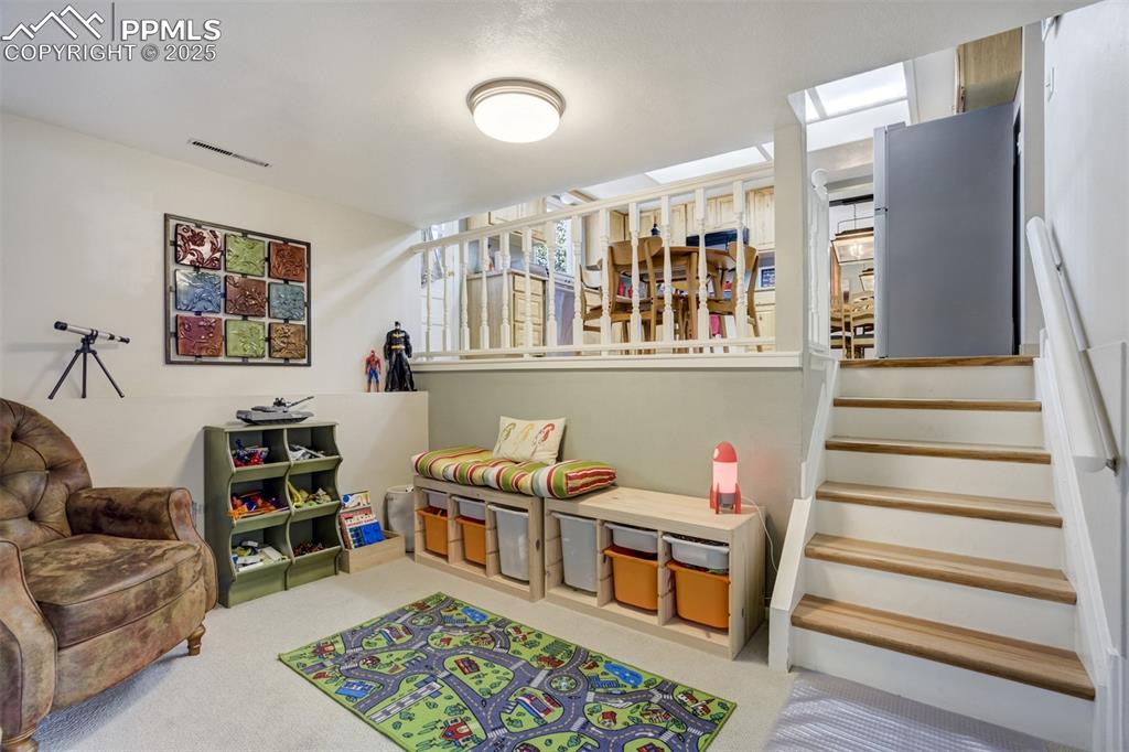 535 Silver Spring Circle Colorado Springs, CO 80919 - Photo 18 of 50 a bedroom with furniture and a book shelf