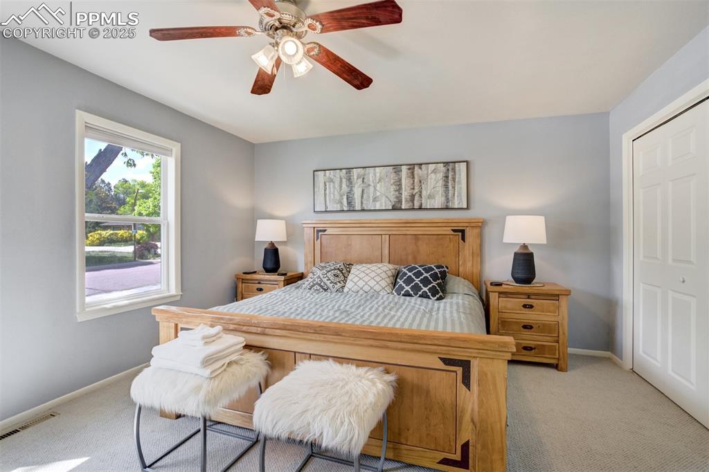 535 Silver Spring Circle Colorado Springs, CO 80919 - Photo 30 of 50 a bedroom with a bed and furniture