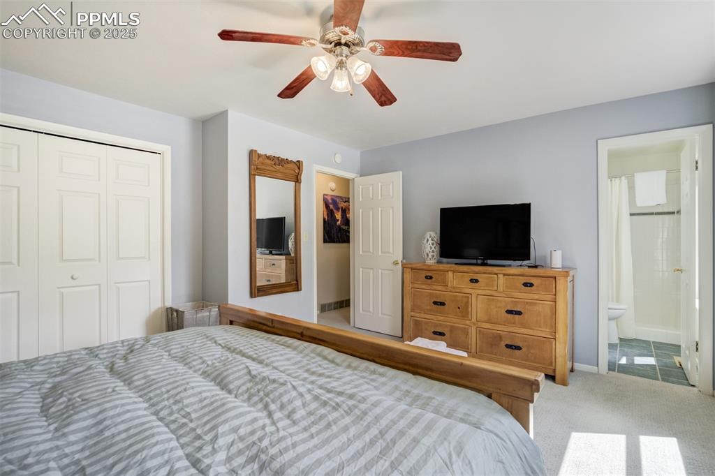 535 Silver Spring Circle Colorado Springs, CO 80919 - Photo 31 of 50 a bedroom with a bed and a flat screen tv