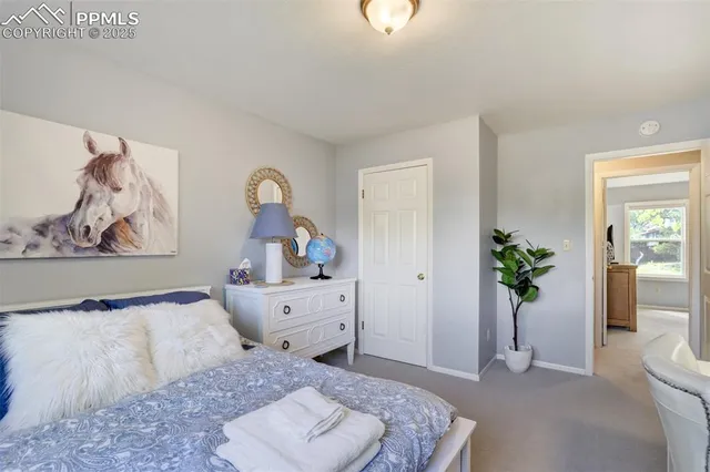 a bedroom with bed and a couch