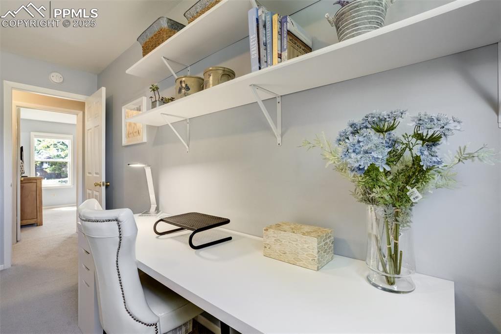 535 Silver Spring Circle Colorado Springs, CO 80919 - Photo 37 of 50 a view of a dining room with furniture and a potted plant