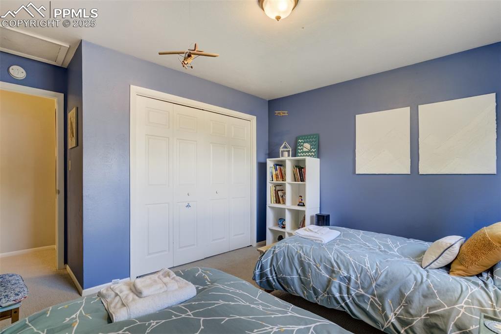 535 Silver Spring Circle Colorado Springs, CO 80919 - Photo 39 of 50 a bedroom with a bed and a dresser