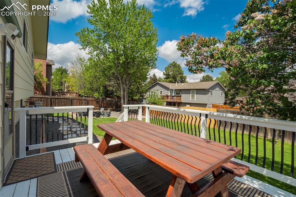 535 Silver Spring Circle Colorado Springs, CO 80919 - Photo 44 of 50 a view of a wooden chairs on deck