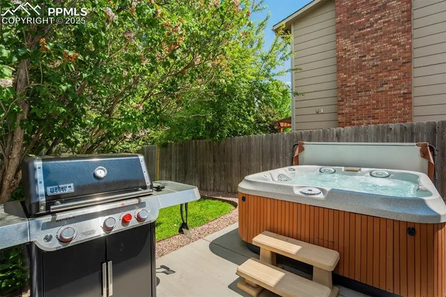 a view of a backyard with sitting area