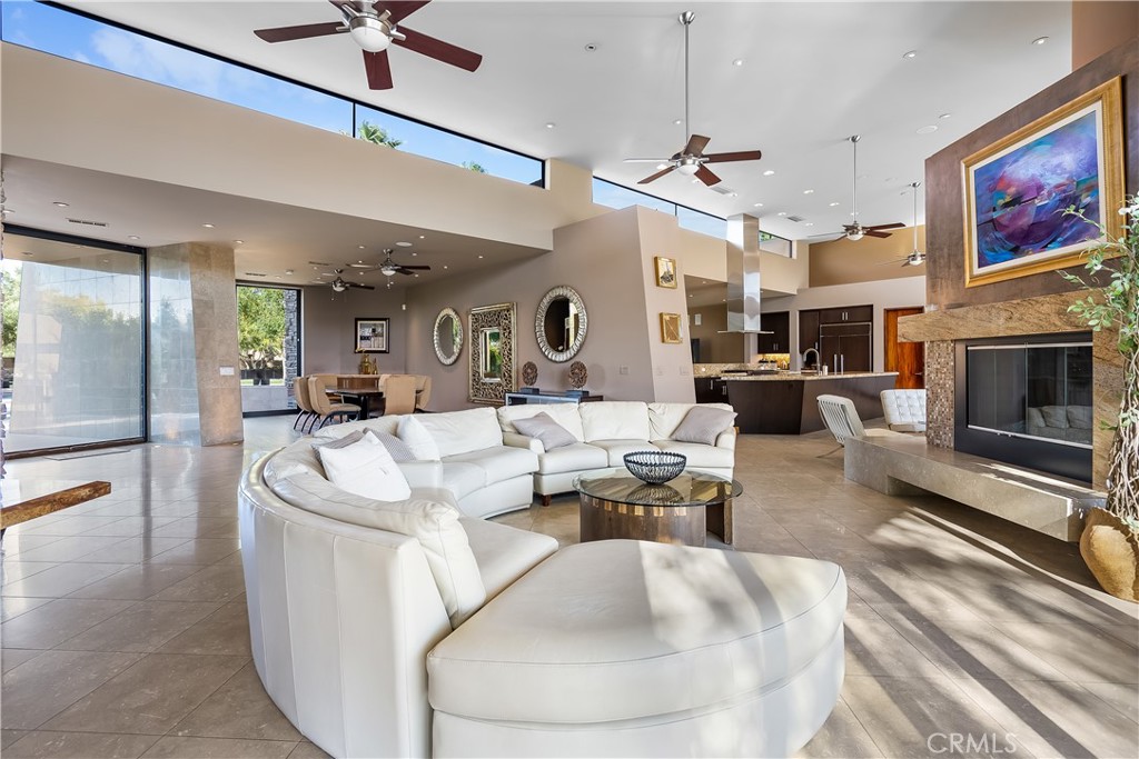 68 Royal St Georges Way Rancho Mirage, CA 92270 - Photo 15 of 73 a living room with fireplace furniture and a chandelier