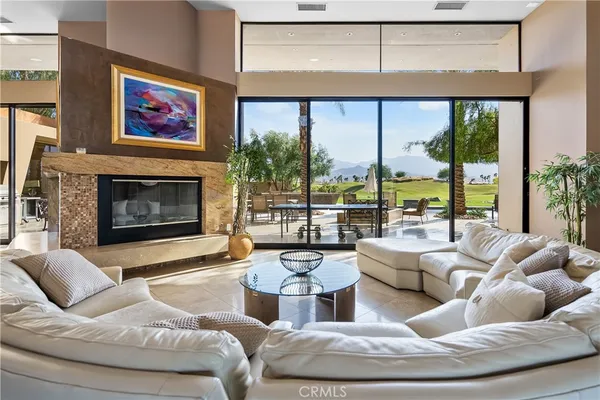 a bedroom with furniture and a flat screen tv