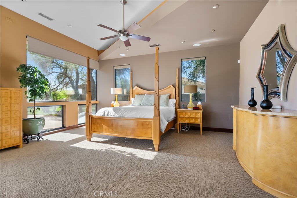 68 Royal St Georges Way Rancho Mirage, CA 92270 - Photo 23 of 73 a bedroom with furniture and a flat screen tv