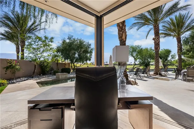 a large bedroom with a large bed and flat tv screen