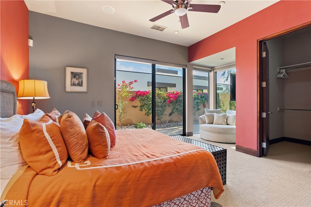 68 Royal St Georges Way Rancho Mirage, CA 92270 - Photo 34 of 73 a bed sitting in a bedroom next to a window