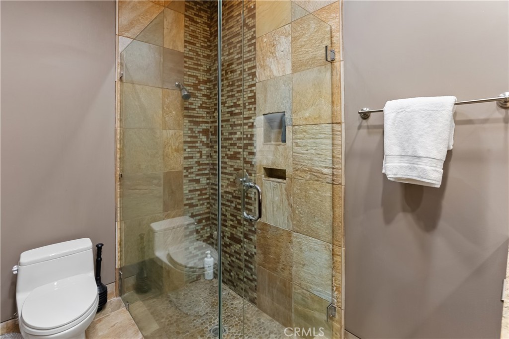 68 Royal St Georges Way Rancho Mirage, CA 92270 - Photo 37 of 73 a bathroom with a toilet and shower