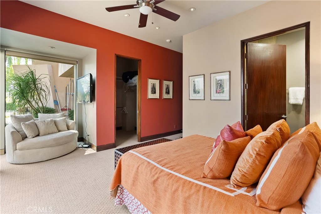 68 Royal St Georges Way Rancho Mirage, CA 92270 - Photo 38 of 73 a bed room with a bed and a couch