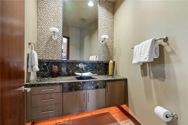 a bedroom with furniture and flat screen tv