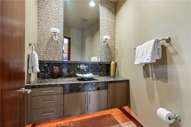 a bedroom with furniture and flat screen tv