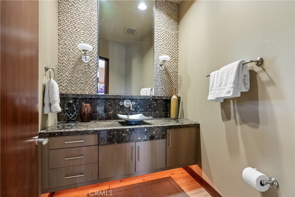 68 Royal St Georges Way Rancho Mirage, CA 92270 - Photo 39 of 73 a bathroom with a granite countertop sink and a mirror