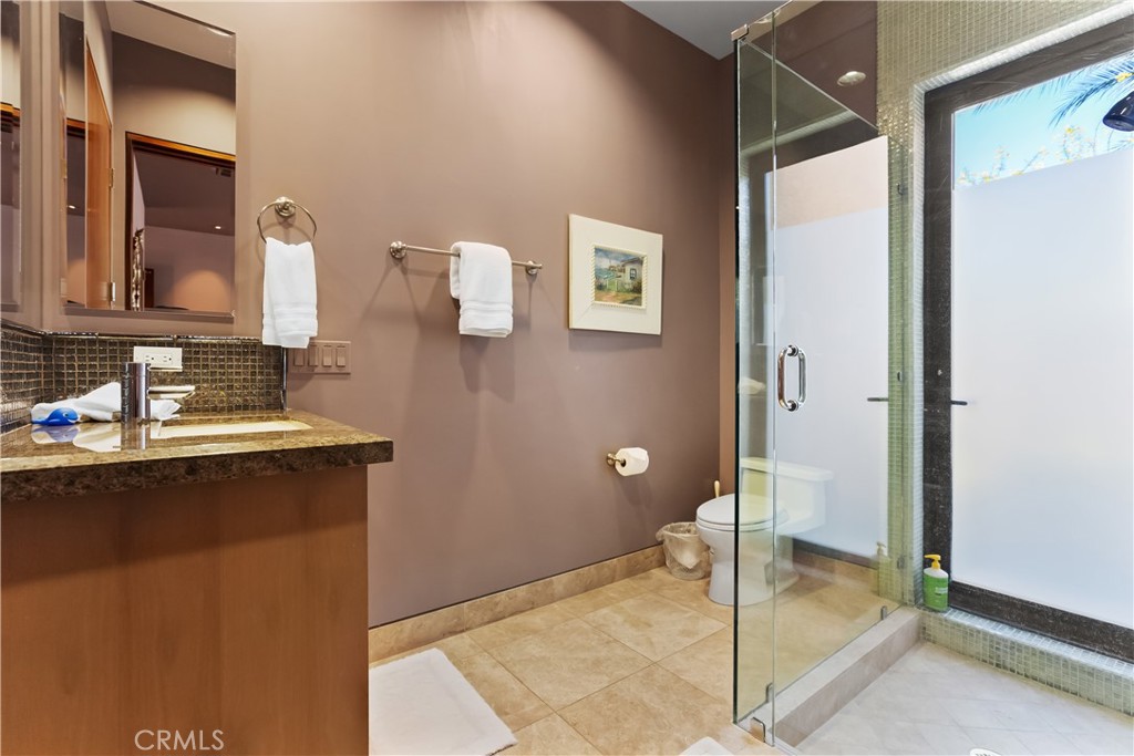 68 Royal St Georges Way Rancho Mirage, CA 92270 - Photo 41 of 73 a bathroom with a sink and a mirror