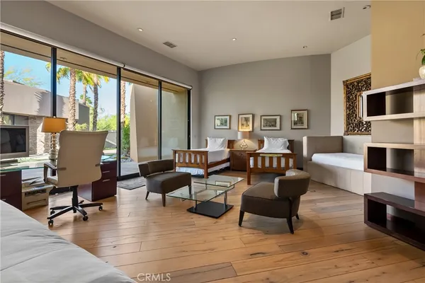 a bathroom with a granite countertop sink a large mirror and a shower