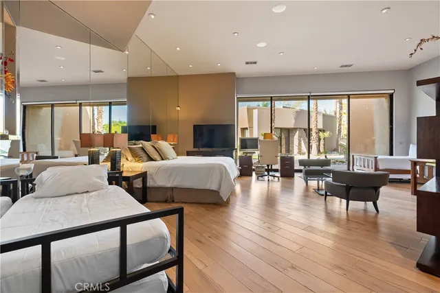 a bedroom with a bed a lamp and window