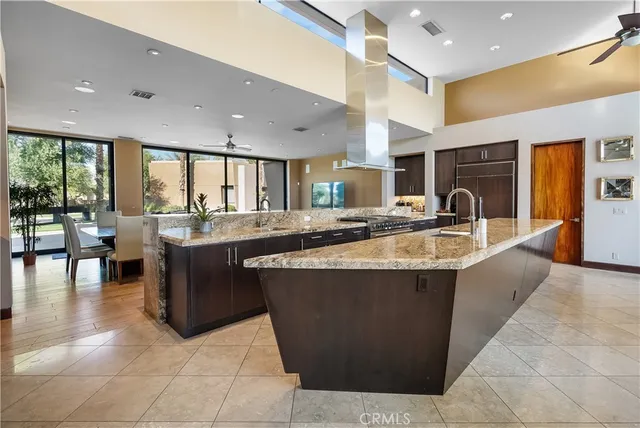 a large kitchen with a table and chairs