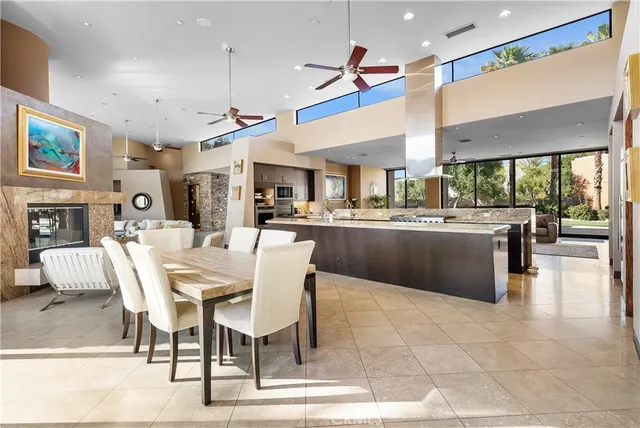 a kitchen with stainless steel appliances granite countertop a stove and a sink
