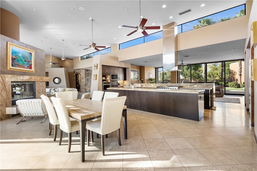 68 Royal St Georges Way Rancho Mirage, CA 92270 - Photo 7 of 73 a large kitchen with a table and chairs