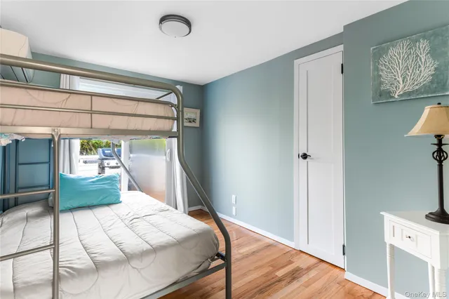 a bathroom with a sink a toilet and shower curtain