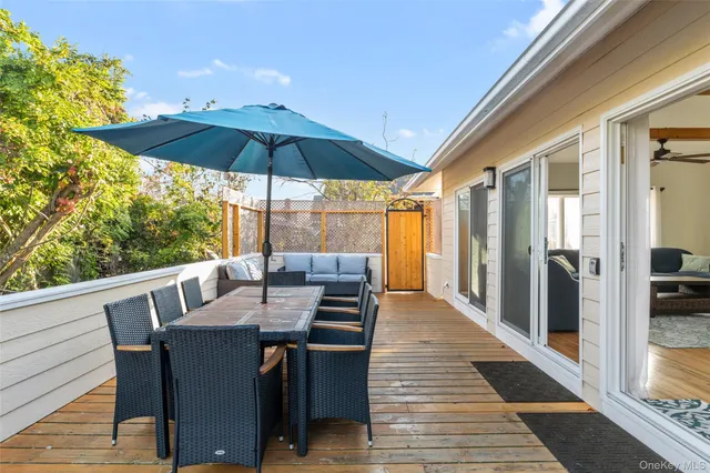 a bedroom with double vanity and a glass door shower