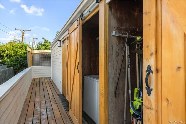 a balcony view with a seating space