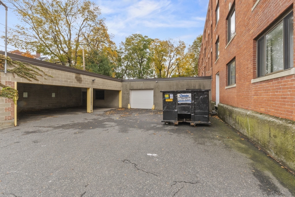 38-40 Cedar Street, Unit 335 Worcester, MA 01609 - Photo 21 of 21 a view of a house with a yard and garage