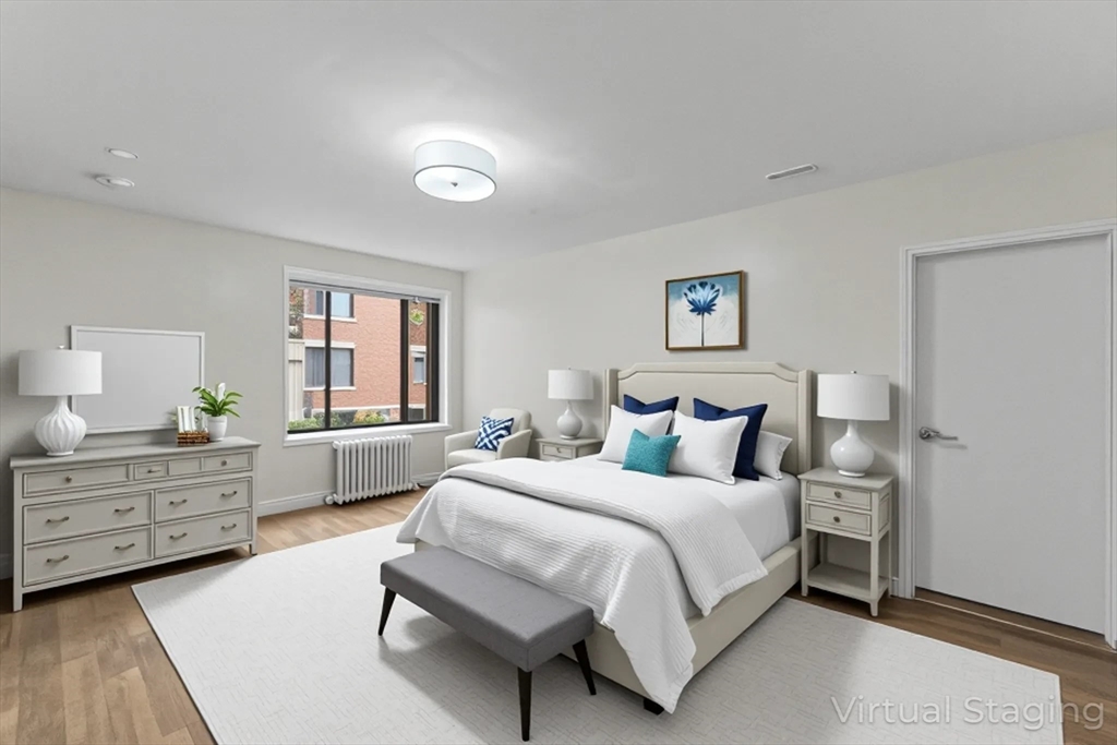 38-40 Cedar Street, Unit 335 Worcester, MA 01609 - Photo 5 of 21 a bedroom with a bed and a dresser